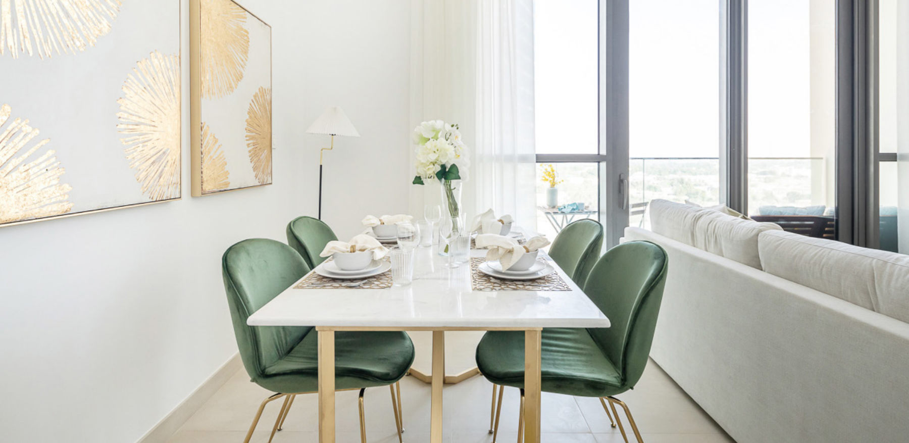 Dining table with green velvet chairs